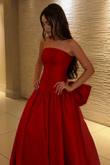 Elegant Red Strapless Ball Gown Prom Dress with Statement Bow Back