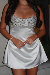 Elegant White Satin Homecoming Dress with Beaded Bodice and Flared Skirt