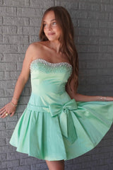 Mint Green Strapless Homecoming Dress with Beaded Neckline and Bow Skirt