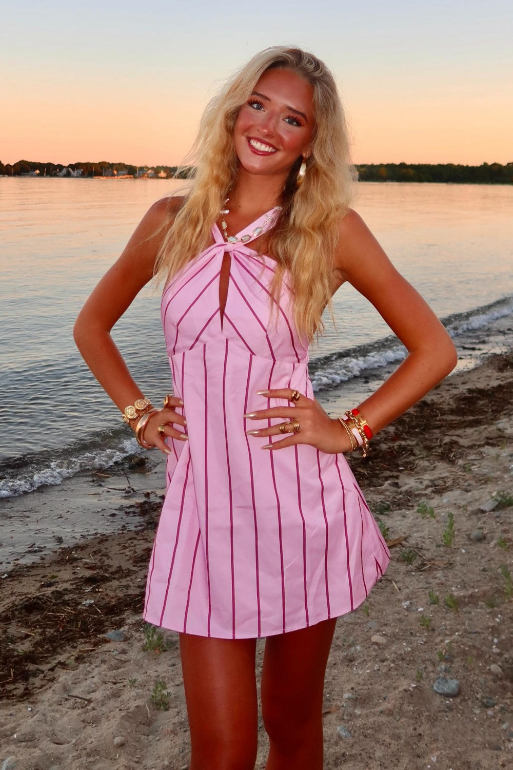 Pink Striped Halter Homecoming Dress with Tie Front Detail and Flared Skirt