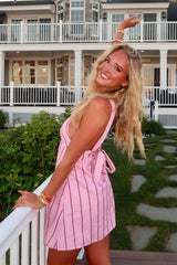 Pink Striped Halter Homecoming Dress with Tie Front Detail and Flared Skirt