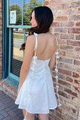 Stylish White Satin Homecoming Dress with Playful Bow Trim Straps